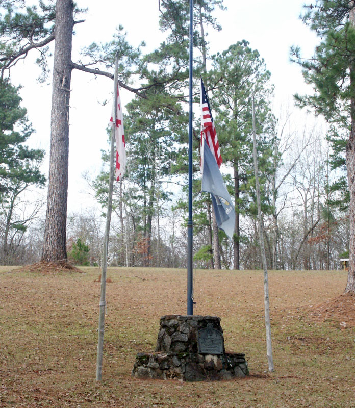 photo of the stone monument and flag pole base erected by the Daughters of the American Colonists