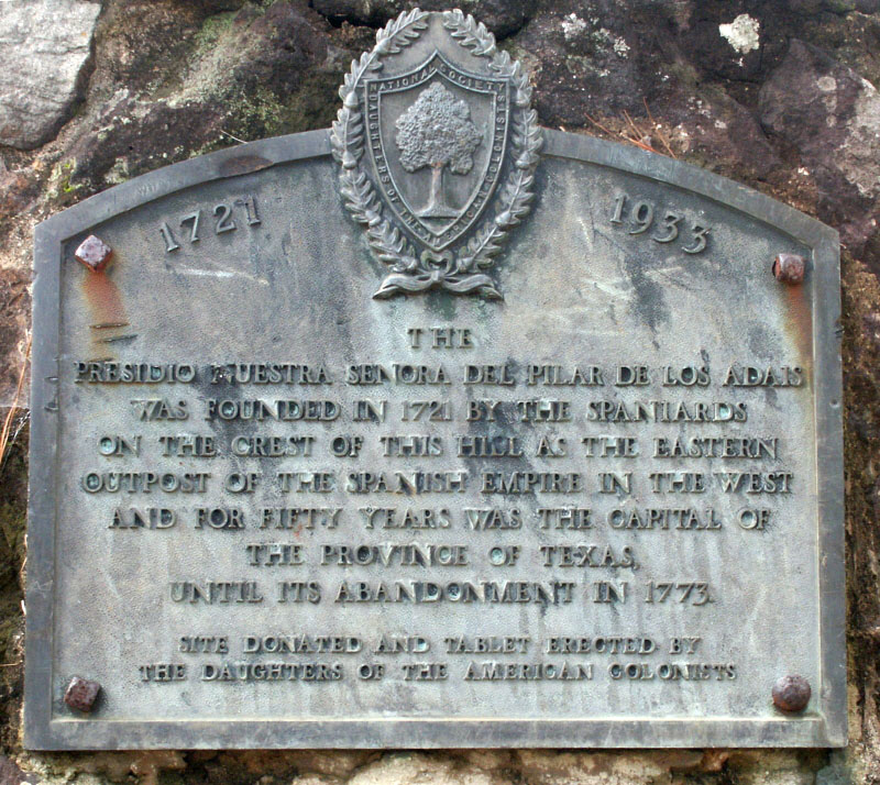 photo of the plaque recognizing the purchase the property containing much of Presidio Los Adaes by the Daughters of the American Colonists