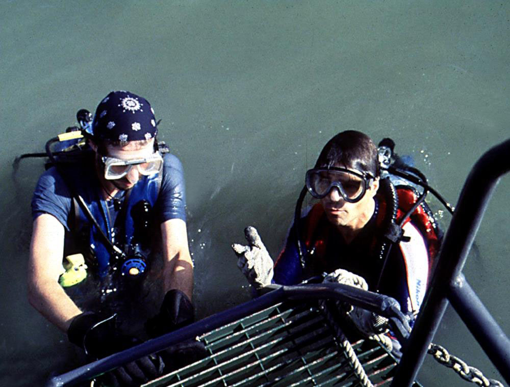 photo of divers on the small exploration boat