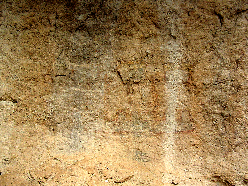Close up of pictographs at Kelly Cave. These paintings were created over 3,500 years ago. Most are thought to be symbolic expressions of the sacred rituals and beliefs of Lower Pecos peoples. 