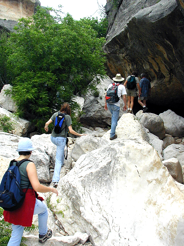 Upstream from Eagle Cave, Mile Canyon continues to narrow and in places we must squeeze between narrow rocky passages.