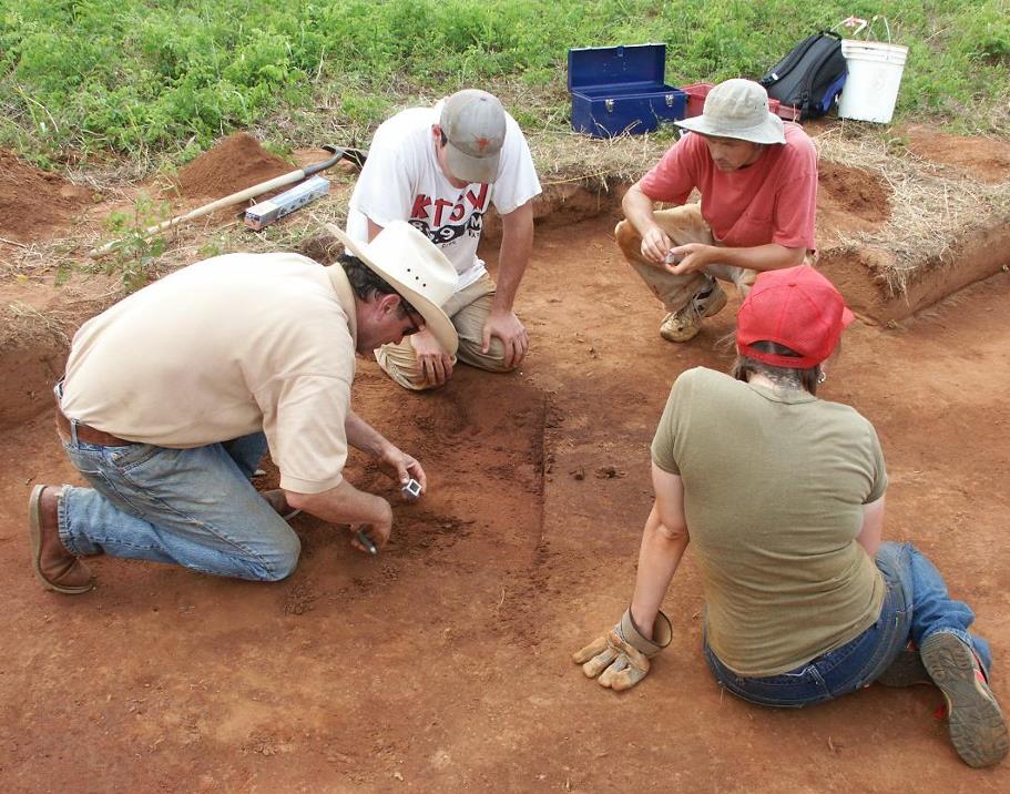 photo of Darrell Creel, left, working with students at the George C. Davis site