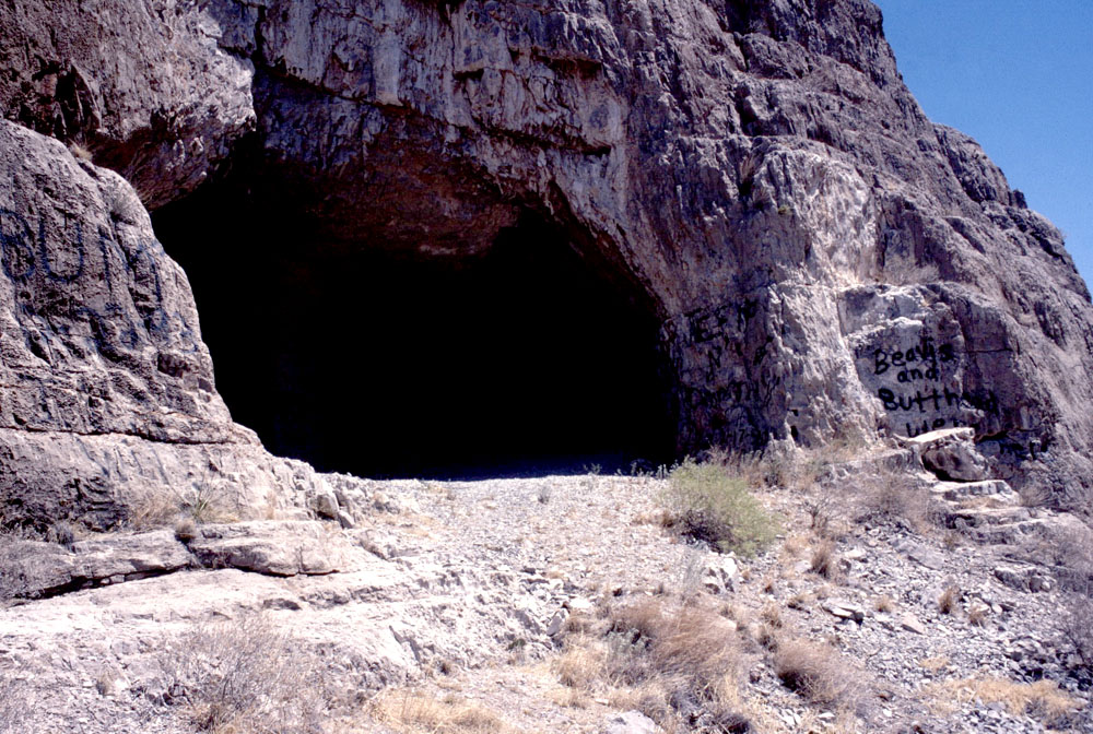 Ceremonial Cave, its opening now marred by graffiti. Early investigator C.B. Cosgrove described its entrance as 27 feet wide and 15 feet high in 1928. Photo by Darrell Creel, 1995.