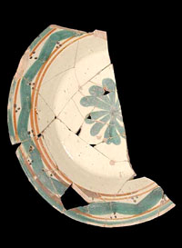 Majolica plate-bowl from the site. Majolica and other fine-glazed wares were imported to the rancho settlements from Mexico. Photo by Milton Bell.