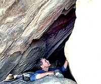 Jay Sharp, photographer for the fieldschool, examines rock art in The Franklin Mountains.