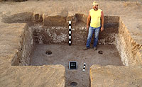 Room 25, with Bob Smith for scale, is another deep pithouse with stepped entry, a hearth and four roof supports. 
