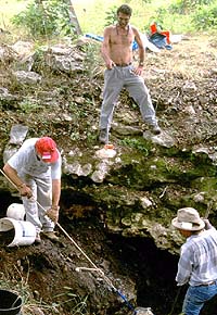 TAS field school participants remove buckets of soil from a deep sinkhole at the Gault site. The hope was that undisturbed Clovis deposits would be found. Instead the sinkhole had a mix of ancient and historic artifacts, indicating it had been filled in recent times.