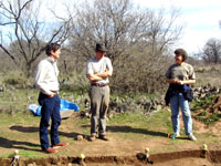 Darrel Creel (left), director of TARL, is given a tour of excavations at the rancheria by Chuck Hixson, and Charlotte Graham. Photo by Steve Black.