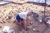 Gene Schaffner excavating one of the houses at the rancheria site. Photo by Chuck Hixson.