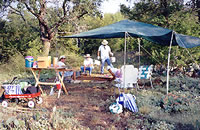 Volunteers take a break from excavating chores. Photo by Joyce Sloan.