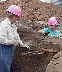 Archeologists from Hicks & Co. excavate a privy. The odd, many-cornered shape of this pit suggests that the privy shaft was moved around a number of times before it was finally covered over. Photo courtesy Hicks & Co.