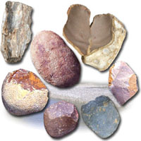 Photograph of multicolored stones on white background.