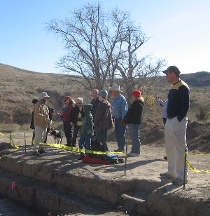 photo of TRC archeologist Paul Matchen, left, leading visitors on a tour of the project area