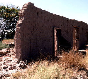 photo of the ruins of adobe-walled structure near the site