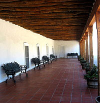 photo of the shady gallery (portal) at Los Portales Cultural Center in San Elizario