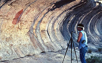 Photographer examines Historic style pictographs at Vaquero Alcove. Photo from ANRA-NPS Archives at TARL.