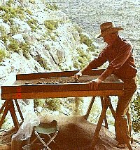 A picturesque spot to sieve for small artifacts turned up in the 1984 excavations at Baker Cave. Photo from TARL archives.