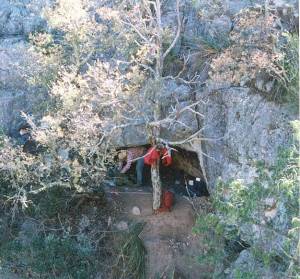 photo of the entrance to Cueva Pilote from a ledge on the opposite side of the narrow canyon, the only place from which it is visible.