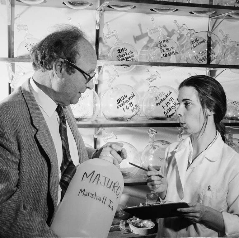 Black and white photograph of a man and a woman in a laboratory