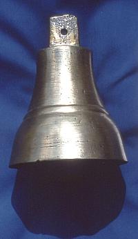 This brass bell, privately owned, was found in a field near the mission. It likely was one of the items taken from the mission by the Indians after the attack. 