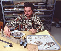 A Texas Tech student works on the continuing analysis of the materials recovered during the 1997 excavation of Mission San Sabá. 