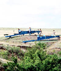 photo of TAS crew water screening. This technique allowed improved recovery of small bones and other tell-tale evidence. 