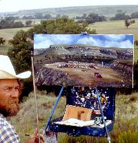 photo of artist Charles Becker , who is painting  scene of TAS dig and Wolf Creek Valley.