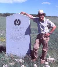 photo of Tom Ellzey beside historical marker