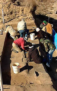 photo of archeologists excavating