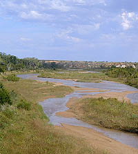 Photo of shallow river and dry valley.