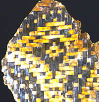 photograph of a yellow and black basket fragment