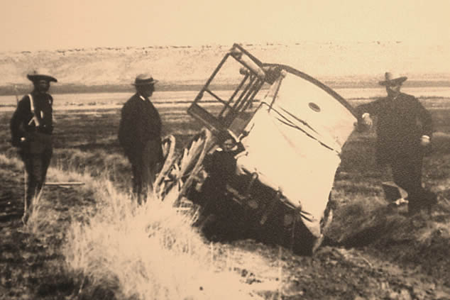 photo of a stagecoach stuck in the mud