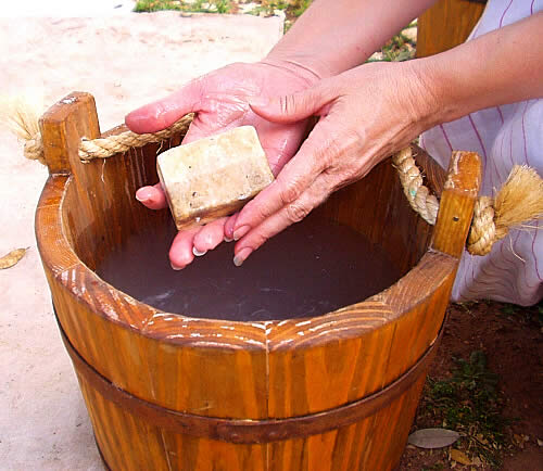 photo of hands holding lye soap