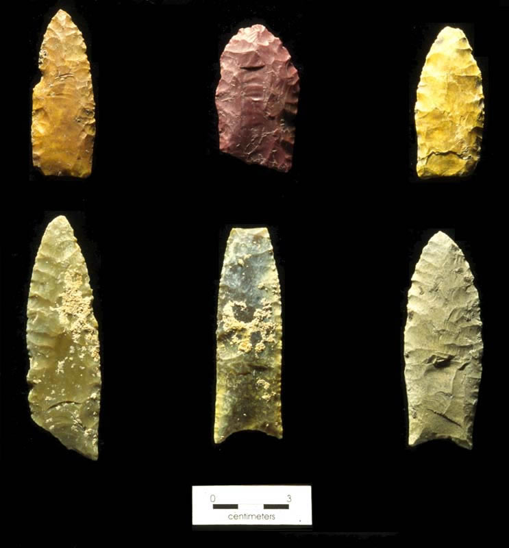 photograph of 6 spear points on a black background