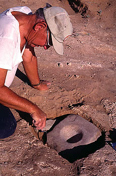 man excavating a mortar