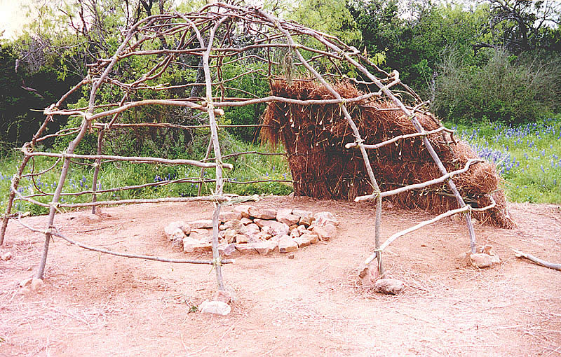 photograph of the skeleton exterior and interior of a wickiup