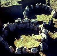Photo showing two stone circles, side by side.