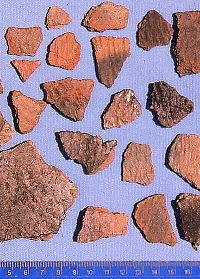 Picture of earth-colored pottery fragments.